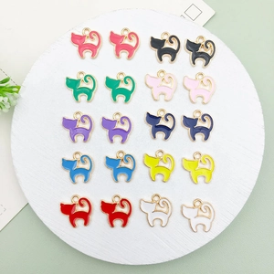 Macro shot of colorful enamel cat pendants for DIY jewelry making in multiple vibrant shades