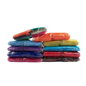 Stack of colorful sheer organza drawstring jewelry pouches in multiple vibrant colors