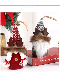 Detail view of handmade Christmas gnomes with elk antlers and snowflake knitted hats