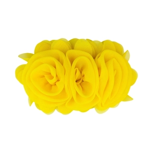 Close-up of yellow chiffon flower accessory with delicate layered fabric petals