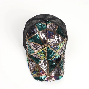 Detailed top view of a glitter sequin baseball cap with colorful geometric patterns