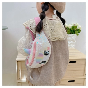 Close-up of cute white unicorn sequin chest bag with rainbow horn worn by a child