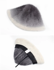 Detail view of gradient rabbit fur bucket hat showing soft texture and adjustable inner drawstring