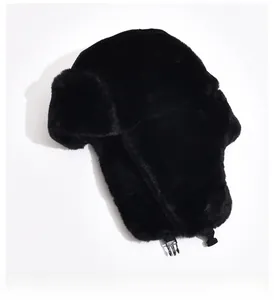 Detailed view of the black faux fur trapper hat with a secure plastic buckle closure