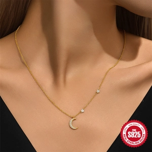 Elegant gold S925 sterling silver necklace with moon and star zircon pendants on a model