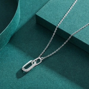 Elegant S925 sterling silver interlocking double ring necklace on a textured dark background