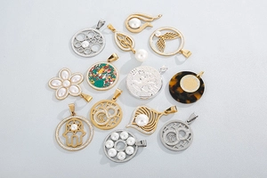 Detailed flat lay of 13 gold and silver steel pendants featuring pearls and textures
