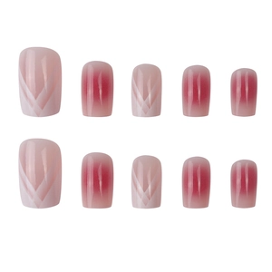 Pink and white gradient press-on nails with minimalist V-shaped lines and blush effect