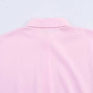 Close-up of the back collar and stitching detail on a pink linen texture blouse