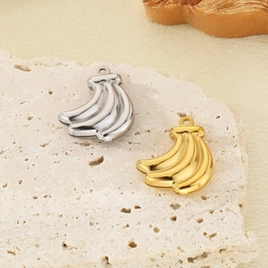 Golden and silver banana pendants on a stone base for DIY jewelry making