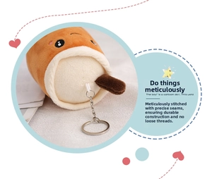 Detailed close-up of the stitching and metal keychain ring on the milk tea plush charm
