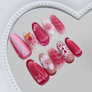 3D floral press-on nails with 3D flower and butterfly patterns on heart tray