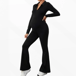 Slim fit black maternity jumpsuit with V-neck zipper and flare leg silhouette