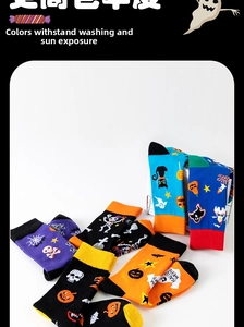 Detailed view of Halloween crew socks featuring pumpkins, skulls, and bat patterns
