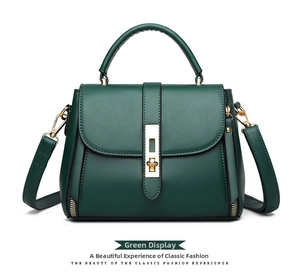 Close-up of dark green PU leather handbag featuring golden hardware and square twist lock