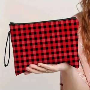 Red and black buffalo plaid makeup bag with a wristlet strap and secure black zipper