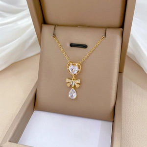 Detailed close-up of butterfly heart water drop pendant with sparkling cubic zirconia