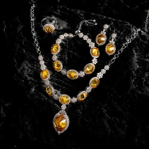 Detailed set of yellow oval cut gemstone necklace, bracelet, earrings and open ring