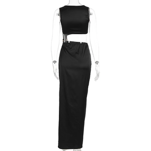 Detail of the backless cutout design on a sleek black evening maxi dress for women