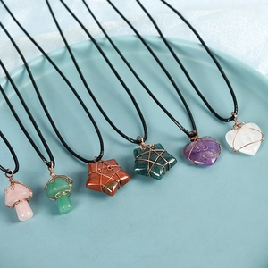 Handcrafted crystal necklaces with wire-wrapped heart, star, and mushroom shaped pendants