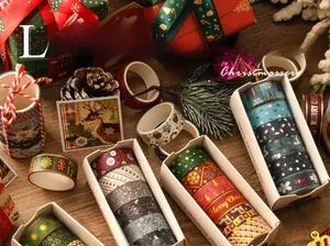 Detailed close-up of Christmas washi tape with gold foil patterns and festive motifs