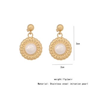 Detailed view of gold stainless steel heart earrings with pearls including size dimensions