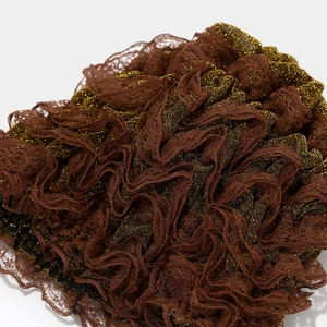 Detailed texture of dark brown lace with gold metallic thread and pleated layered design