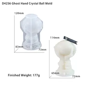 Detailed view of skeleton hand holding crystal ball silicone mold and finished resin casting