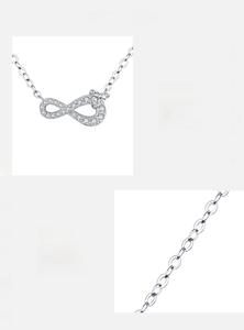 Macro shot of 925 sterling silver infinity necklace with a heart-shaped cubic zirconia