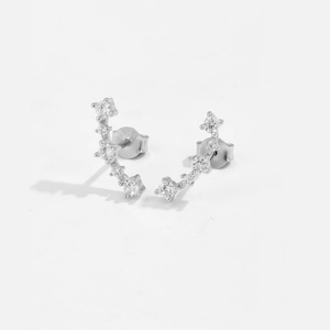 Close-up of S925 sterling silver curved stud earrings featuring five claw-set cubic zirconias