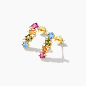 Close-up of S925 silver stud earrings with colorful square zircons and gold plating