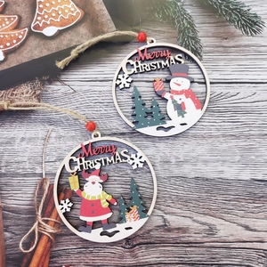 Detail view of round wooden Christmas ornaments featuring Santa and Snowman designs