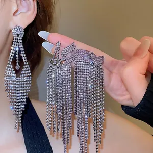 Elegant geometric purple tassel earrings with sparkling rhinestones and silver needles