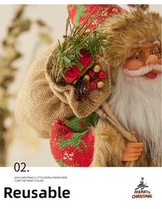 Close-up of Santa Claus doll with red knit clothes, gold glasses and gift bag detail