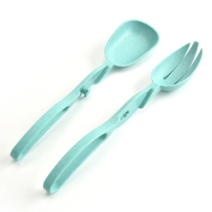 Eco-friendly wheat straw salad servers set with large spoon and fork in light cyan color