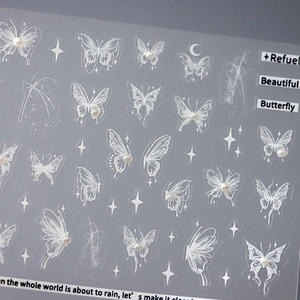 5D embossed butterfly nail stickers with 3D pearls and artistic white butterfly patterns