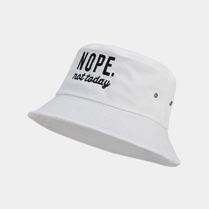 Detail view of cotton bucket hat with black embroidery and metal side ventilation eyelets