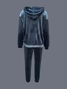 Back view of dark blue velvet tracksuit featuring a long-sleeve hoodie and jogger pants