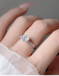 Macro shot of 925 silver moissanite ring with six-prong setting and hollow crown design
