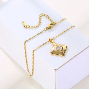 Luxurious gold stainless steel necklace with sparkling square zircon pendant on pedestal