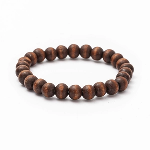 Detail of dark brown wooden bead bracelet with smooth texture and natural wood grain finish