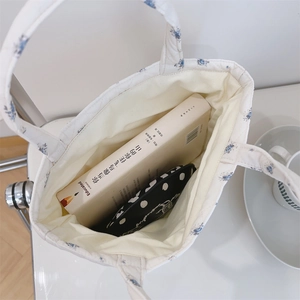 Close-up of floral quilted tote bag interior showing spacious capacity and soft fabric
