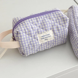 Quilted berry checkered makeup bag with zipper closure and portable cotton handle