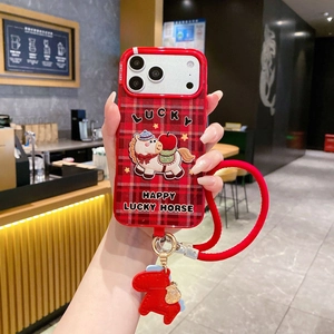 Detail of red plaid iPhone case featuring a cartoon horse patch and braided hand strap