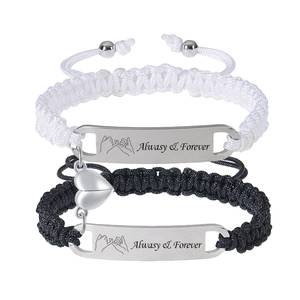 Close-up of magnetic heart charms and engraved Always & Forever bracelets for couples