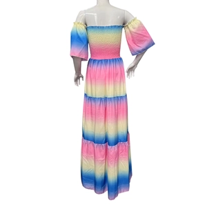 Detail of tiered rainbow gradient skirt with smocked bodice and layered ruffles