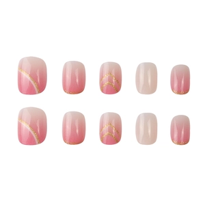 Short round pink gradient press-on nails with white curves and gold glitter accents