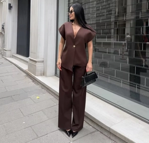 Deep brown two-piece set featuring sleeveless V-neck top and high-waist wide-leg trousers