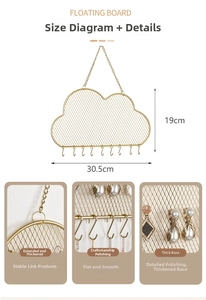 Detail of cloud-shaped gold metal jewelry grid rack with eight functional hooks