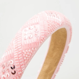 Pink handmade beaded headband featuring geometric patterns with sequins and crystals